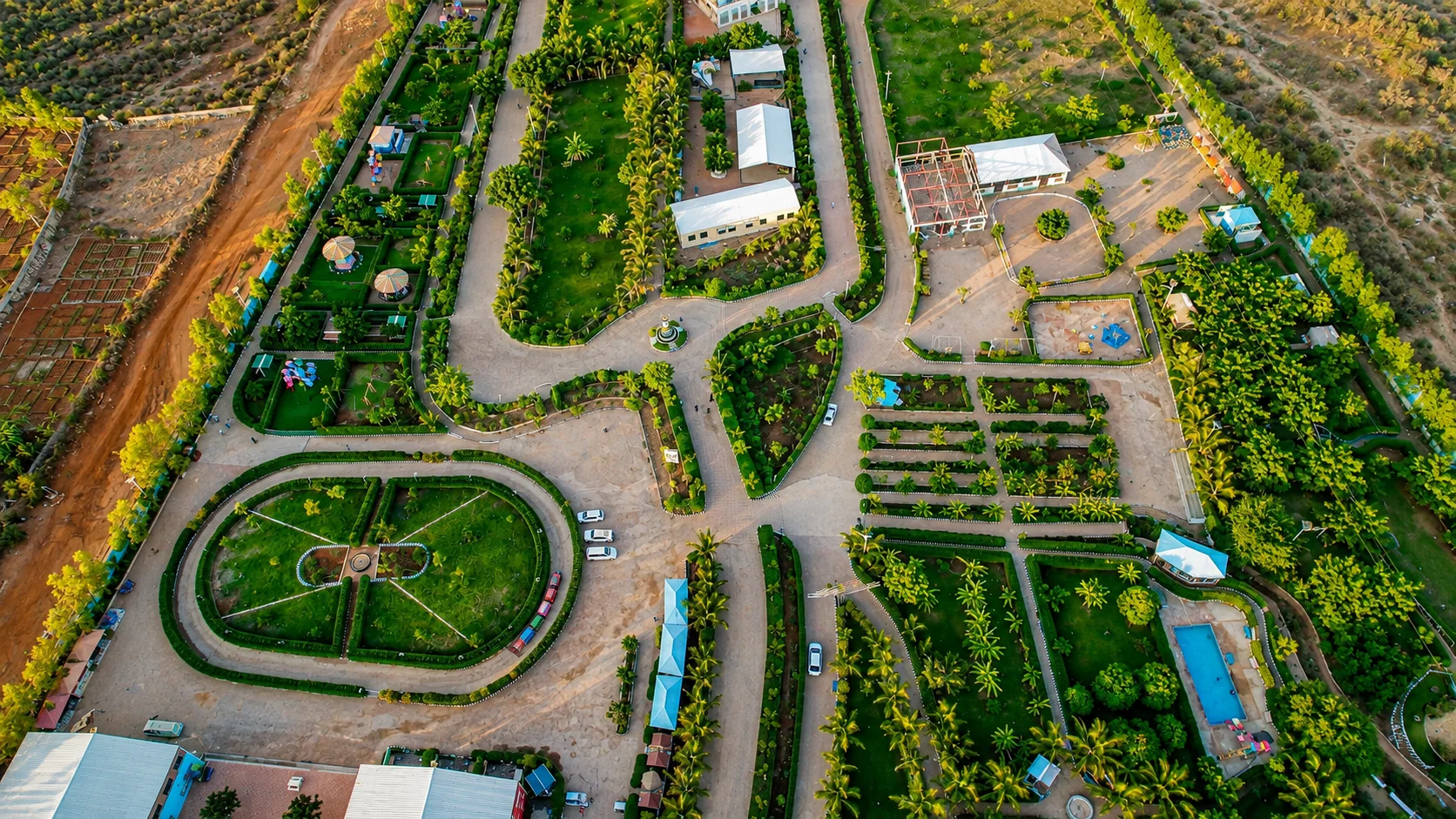 Landscaped garden beds and walkways at Baidoa City Park