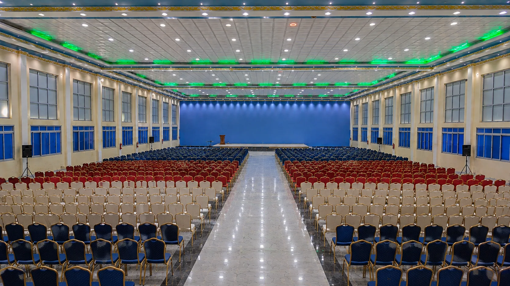 Large event auditorium with tiered seating and stage lighting
