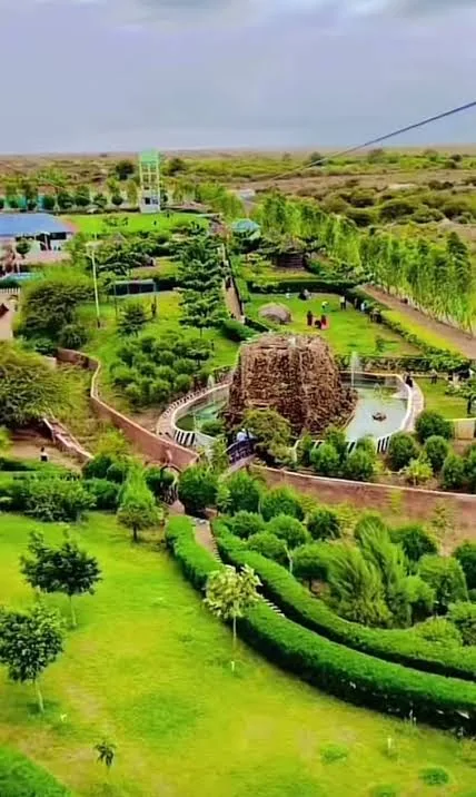 Hedged walking pathways winding through Baidoa City Park