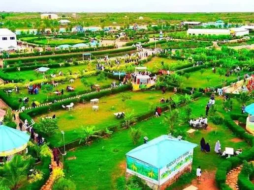 Visitors enjoying the lawns of Baidoa City Park